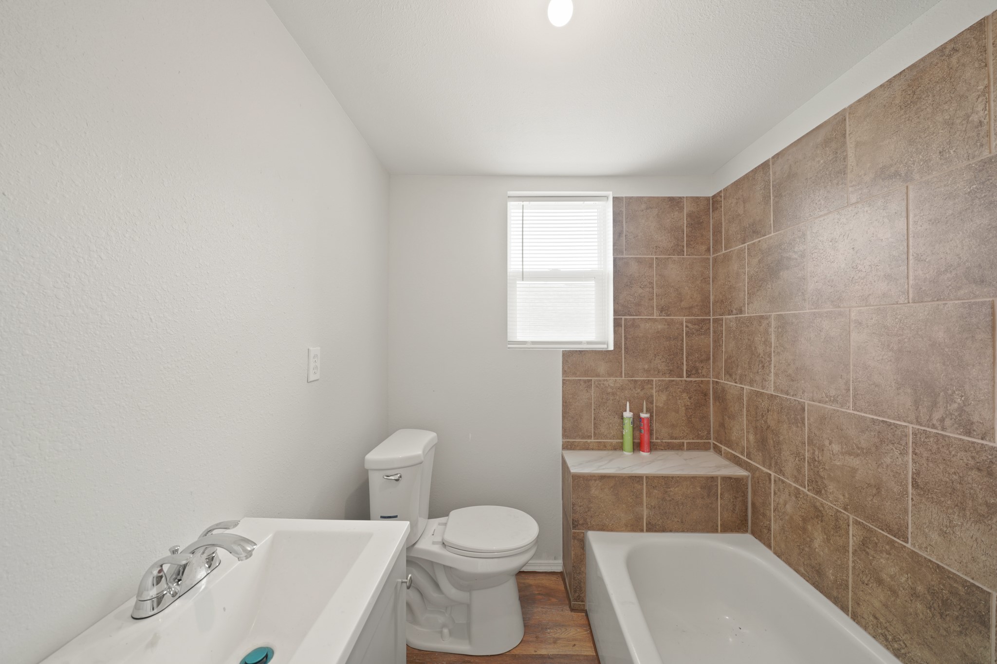 5307 Crane Street Houston, TX 77026 - Photo 17 of 41 a bathroom with a toilet a sink and bathtub
