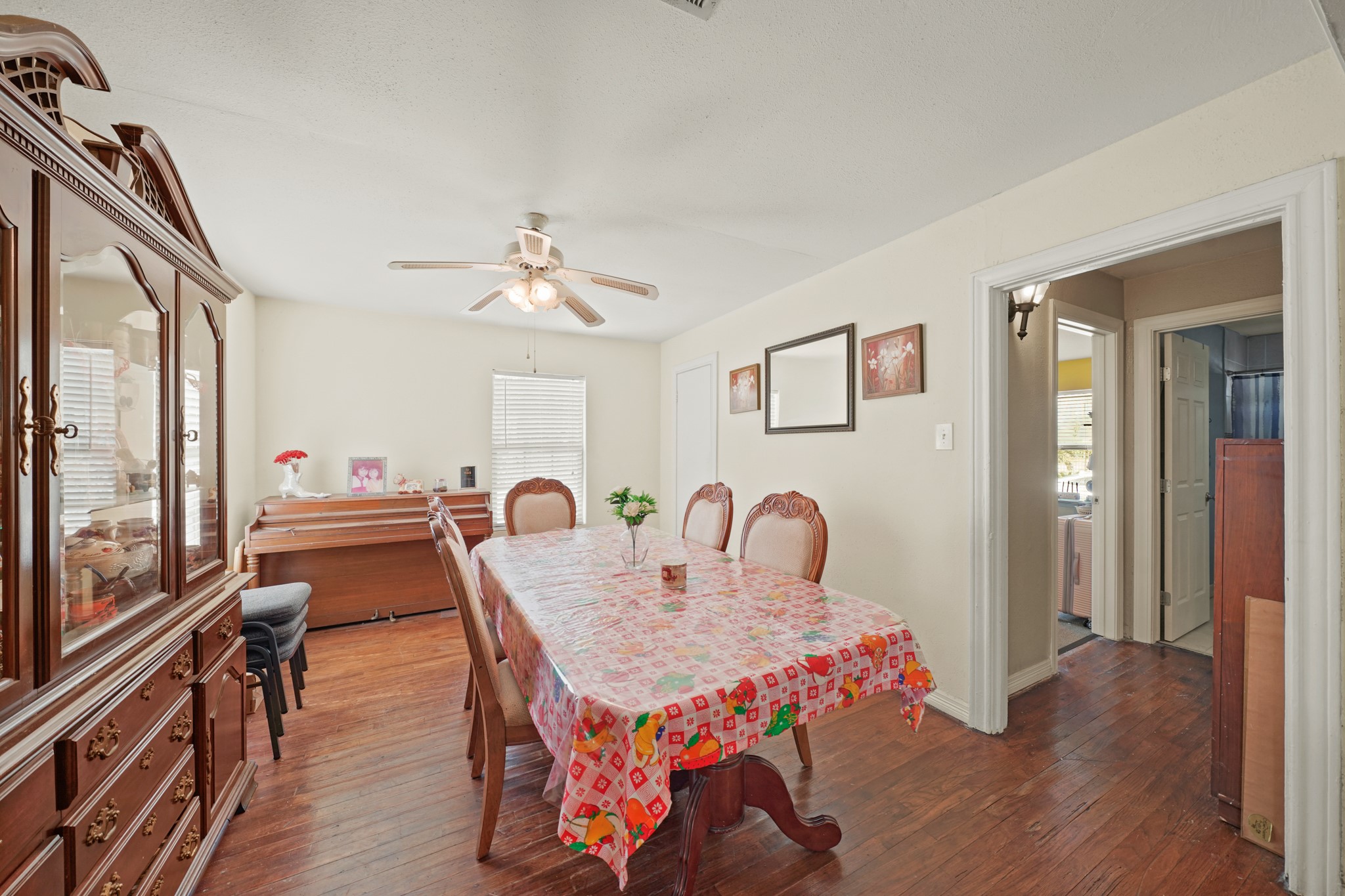 5307 Crane Street Houston, TX 77026 - Photo 32 of 41 a dining room with furniture a window and wooden floor
