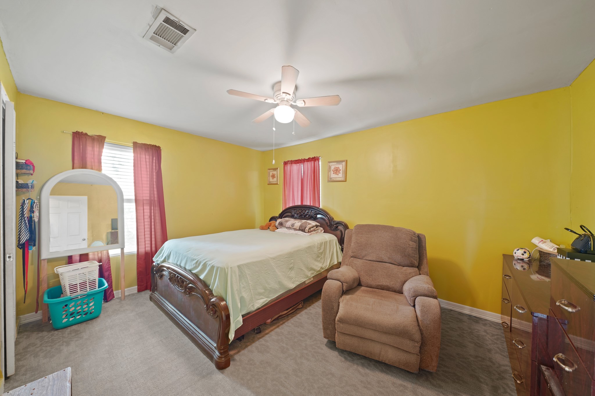 5307 Crane Street Houston, TX 77026 - Photo 38 of 41 a bedroom with a bed and a chandelier