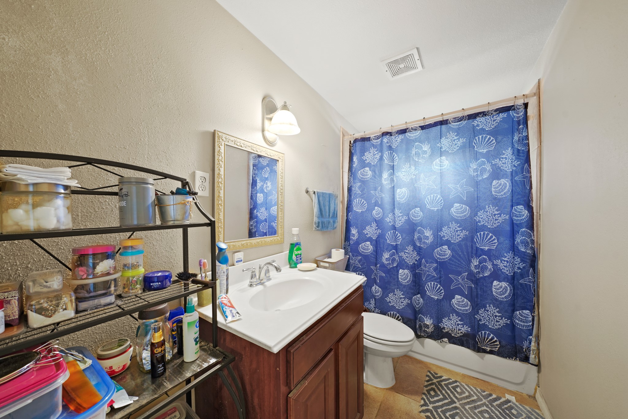 5307 Crane Street Houston, TX 77026 - Photo 40 of 41 a bathroom with a sink mirror vanity and toilet