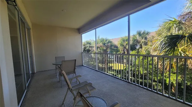 a view of a chairs and table in patio of the house