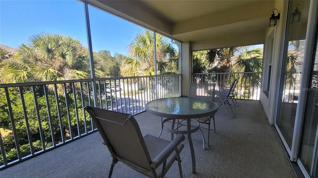 a view of a bedroom with baby crib and lounge chair