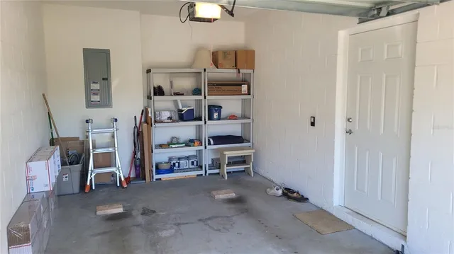 a sign broad in front of red brick house