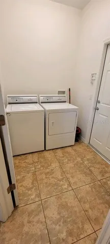 a kitchen with granite countertop a sink and cabinets