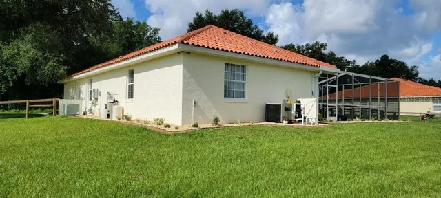 a view of a swimming pool with a lounge chairs
