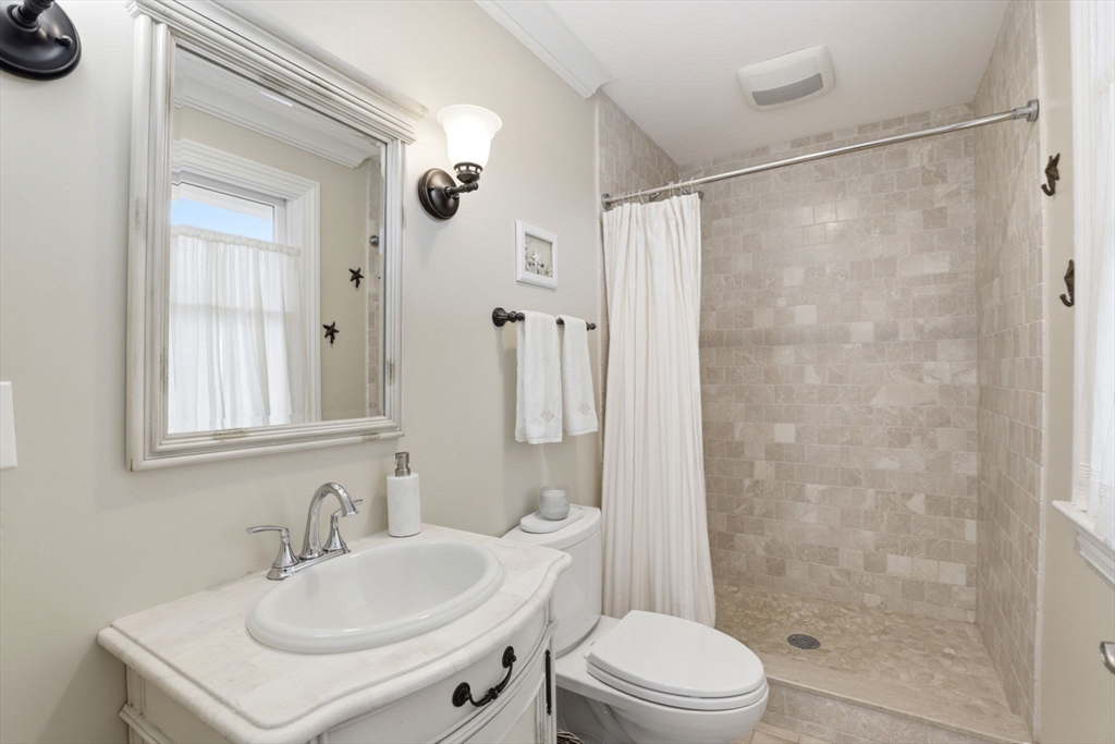 60 Holbrook Avenue Hull, MA 02045 - Photo 16 of 37 a bathroom with a sink toilet and shower