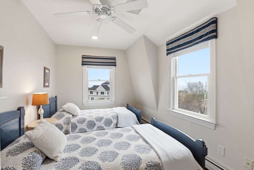 60 Holbrook Avenue Hull, MA 02045 - Photo 20 of 37 a bedroom with a large bed and a window