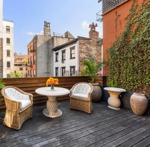 a spacious bedroom with a bed and glass door