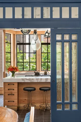 a living room with furniture and flowers