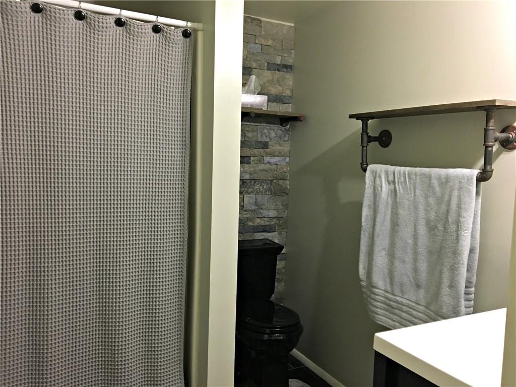 301 Wilson Road Clinton, PA 15026 - Photo 11 of 25 WOW!! Check out the stone wall and custom made towel rack/shelf featured in the newly remodeled Master Bath.