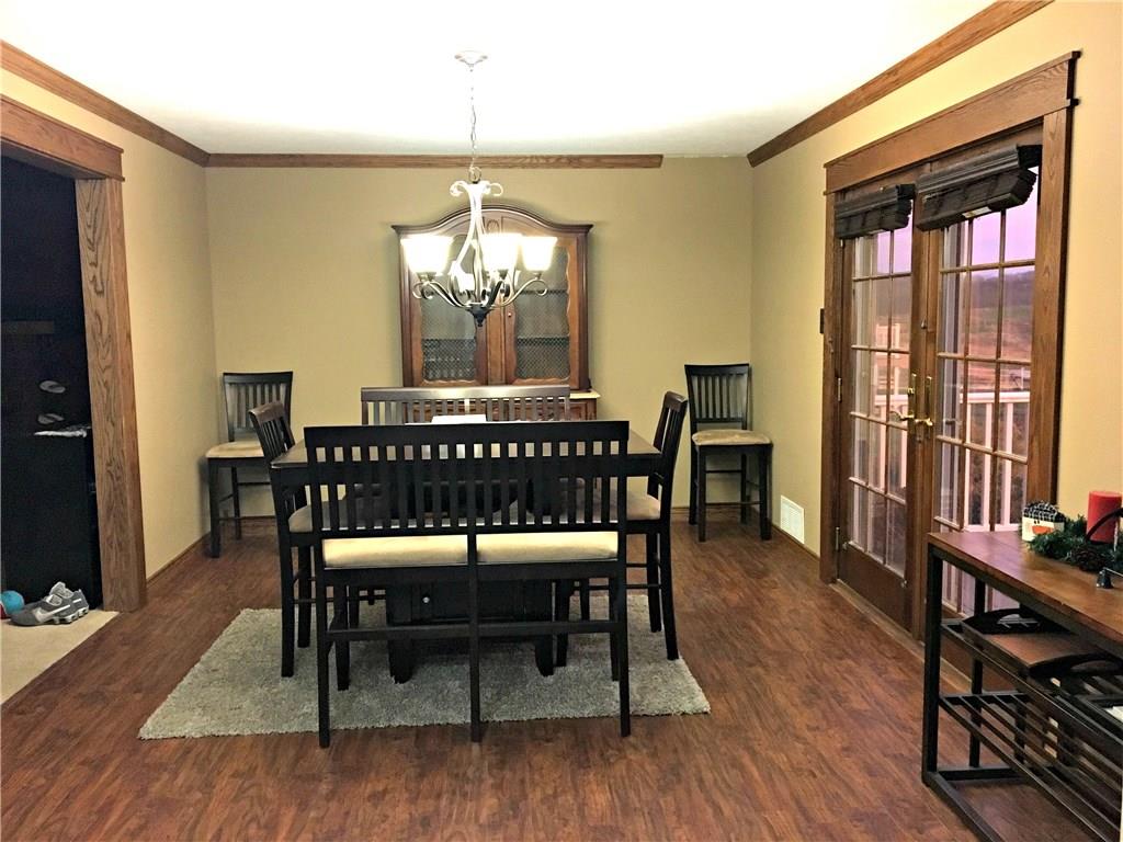 Real oak trim paneling was recently added, as well as new flooring and oak french doors.  