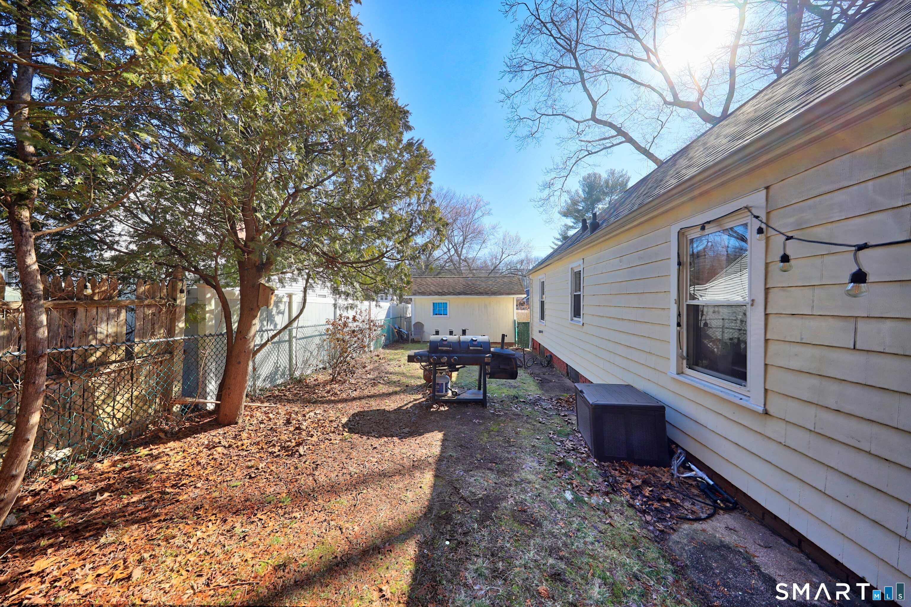 196 Waite Street Hamden, CT 06517 - Photo 13 of 15 a view of a backyard with large trees