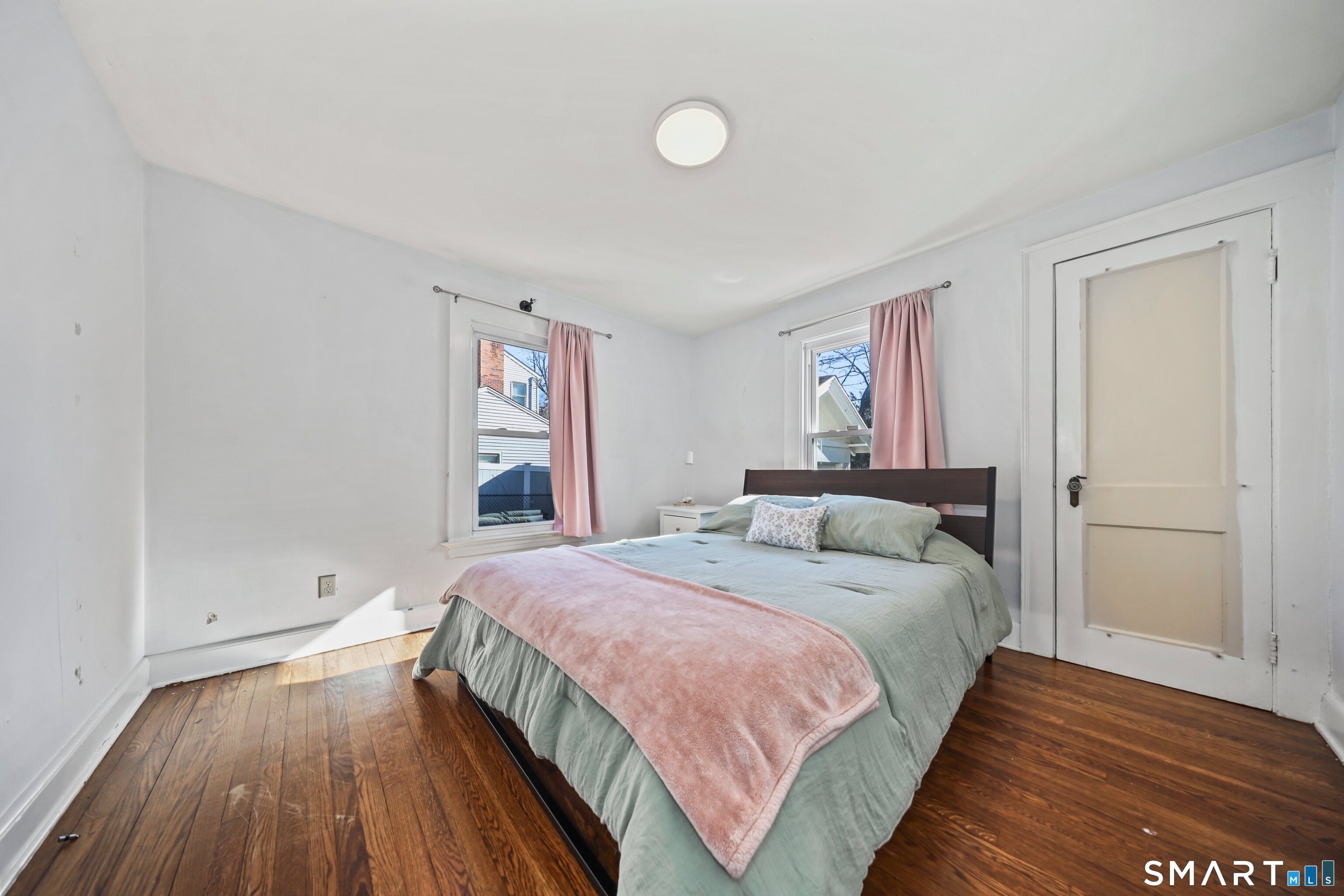 196 Waite Street Hamden, CT 06517 - Photo 6 of 15 a bedroom with a bed and wooden floor