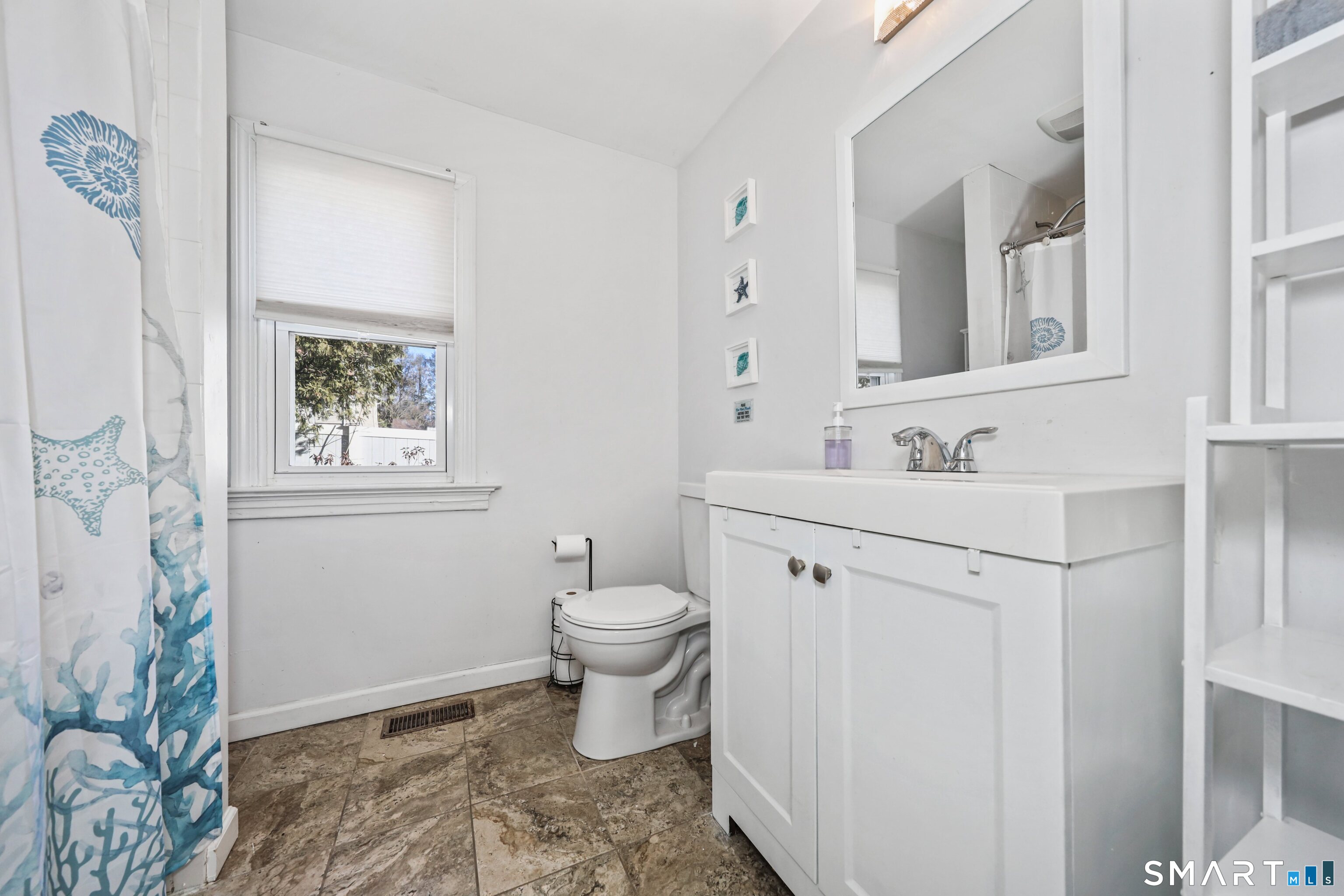 196 Waite Street Hamden, CT 06517 - Photo 7 of 15 a bathroom with a toilet sink and mirror