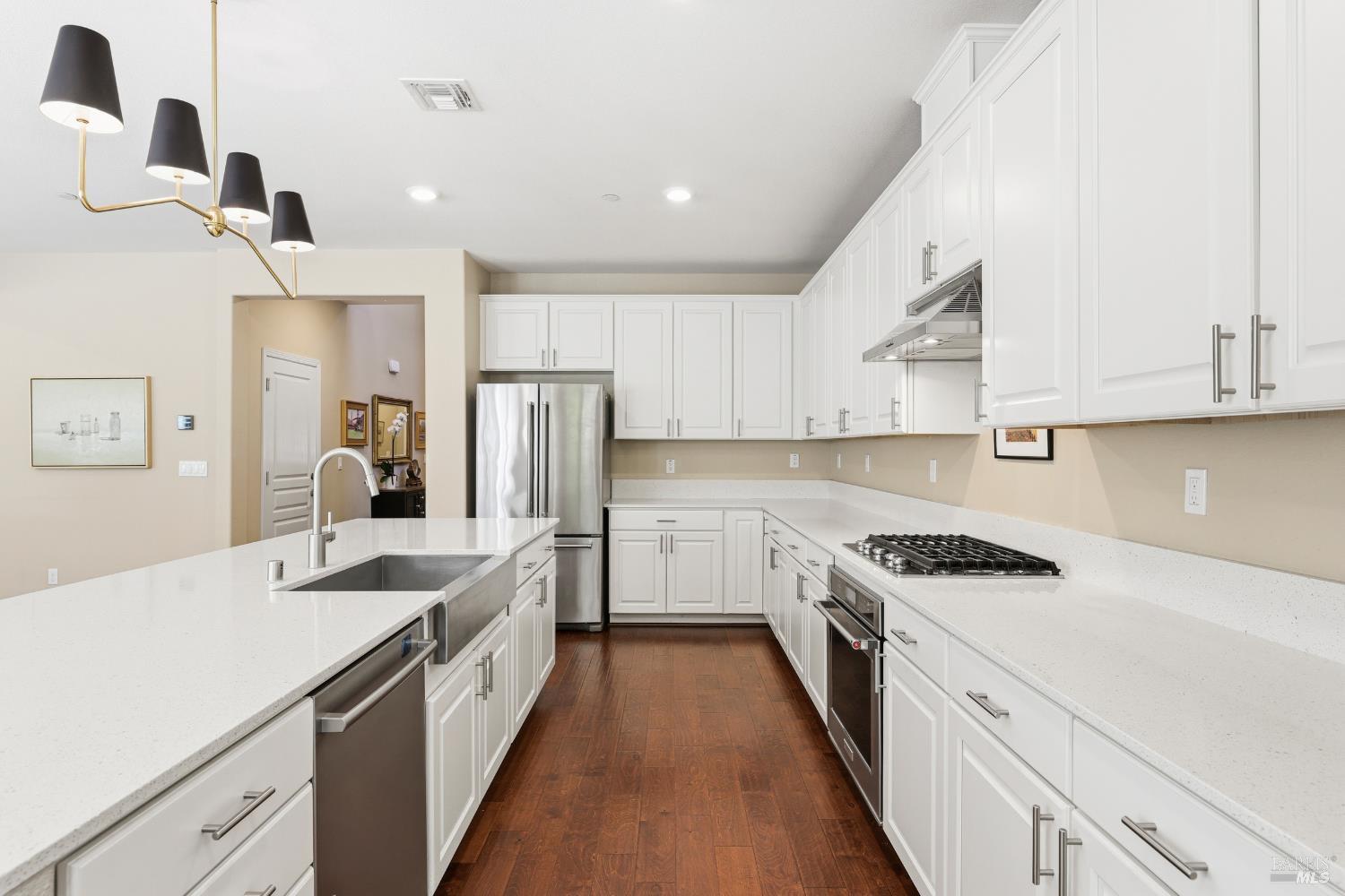 5533 Kennedy Place Rohnert Park, CA 94928 - Photo 5 of 63 a kitchen with white cabinets and appliances