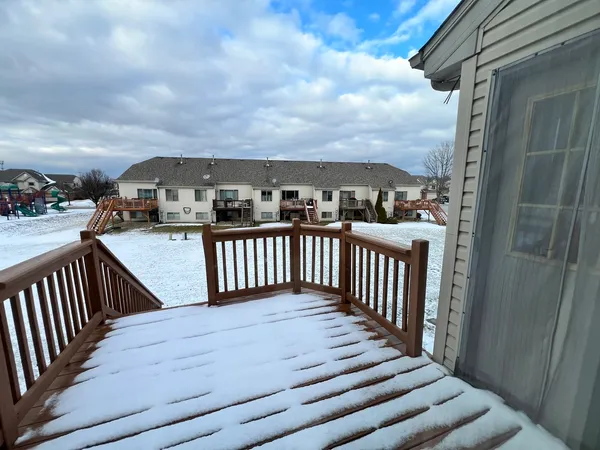 a view of a balcony with wooden floor
