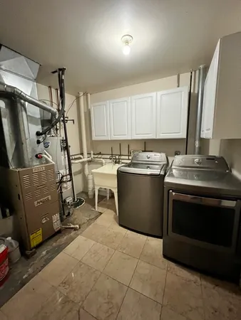 a kitchen with a stove a sink and a refrigerator