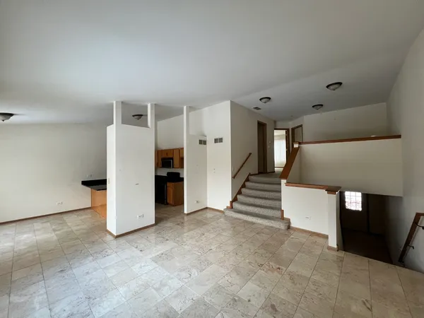 a view of a livingroom with a kitchen