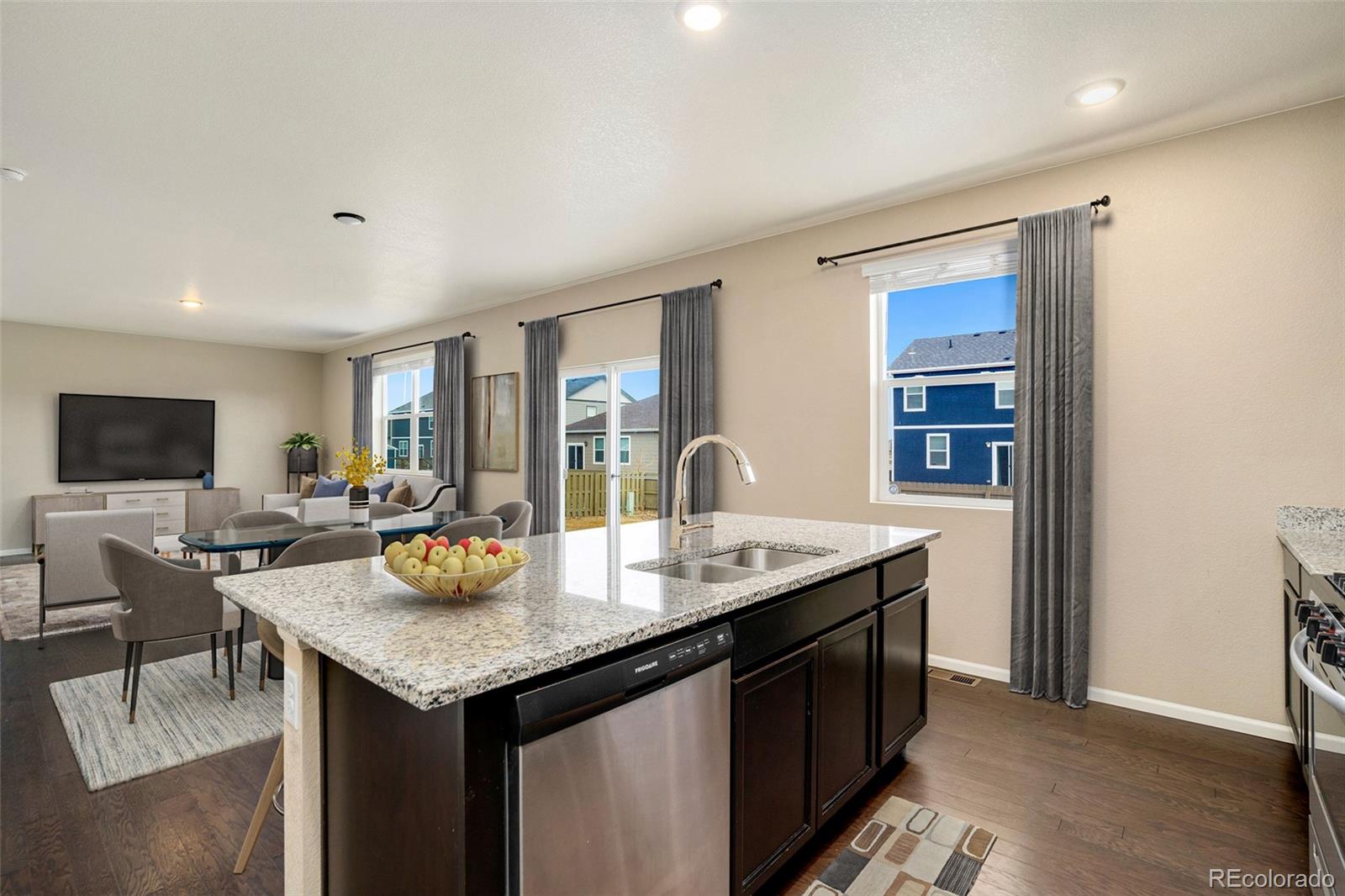 415 3rd Street Severance, CO 80550 - Photo 11 of 27 a living room with granite countertop furniture and a flat screen tv