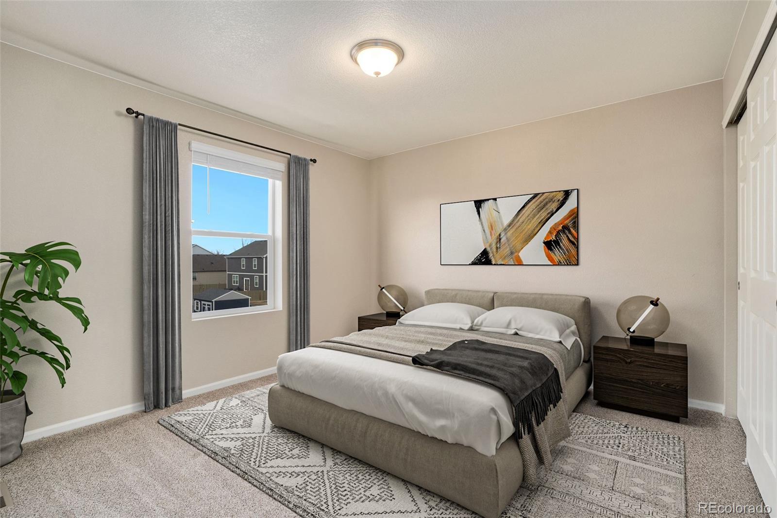 415 3rd Street Severance, CO 80550 - Photo 19 of 27 a bedroom with a bed and a painting on the wall