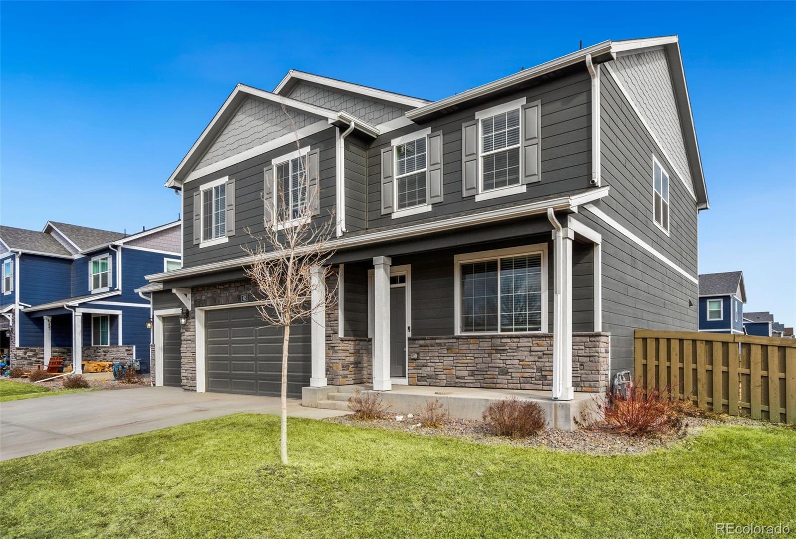 415 3rd Street Severance, CO 80550 - Photo 2 of 27 front view of a house with a yard