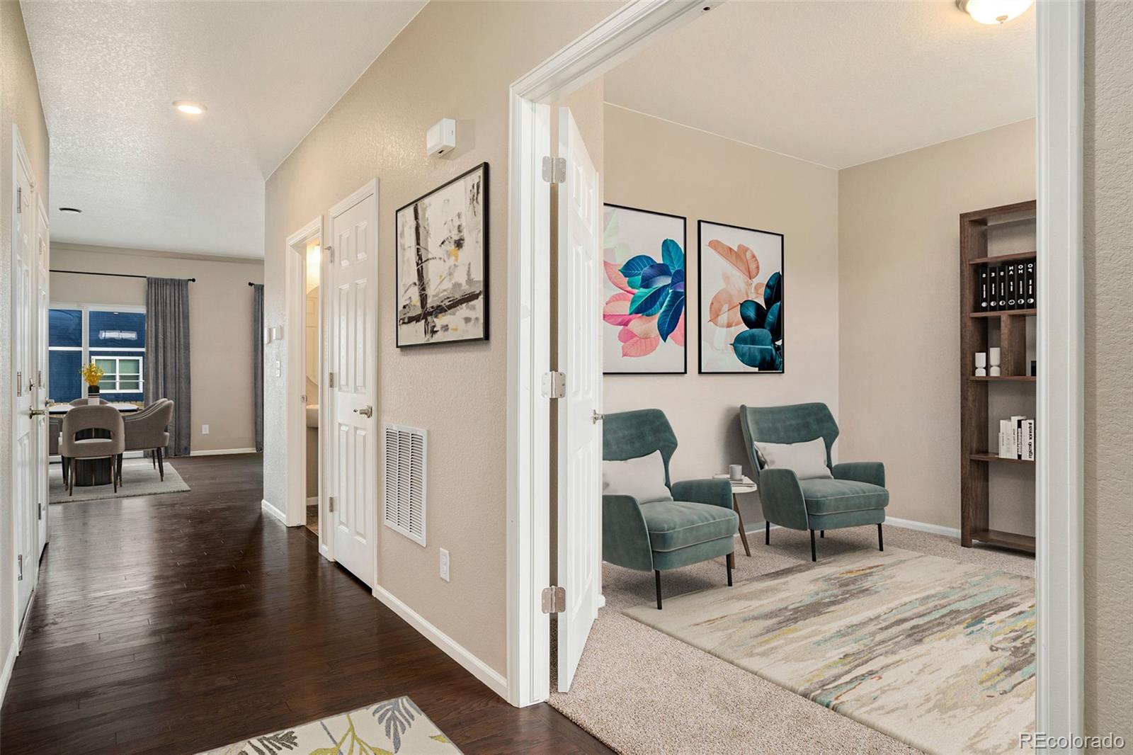 415 3rd Street Severance, CO 80550 - Photo 24 of 27 a living room with furniture and wooden floor