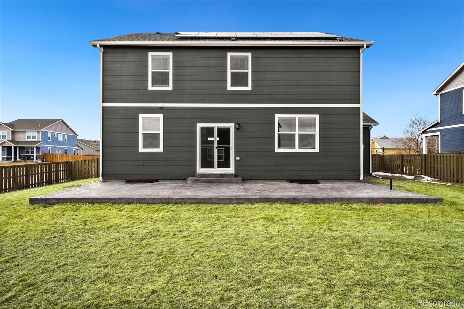 415 3rd Street Severance, CO 80550 - Photo 25 of 27 a house view with swimming pool in front of it