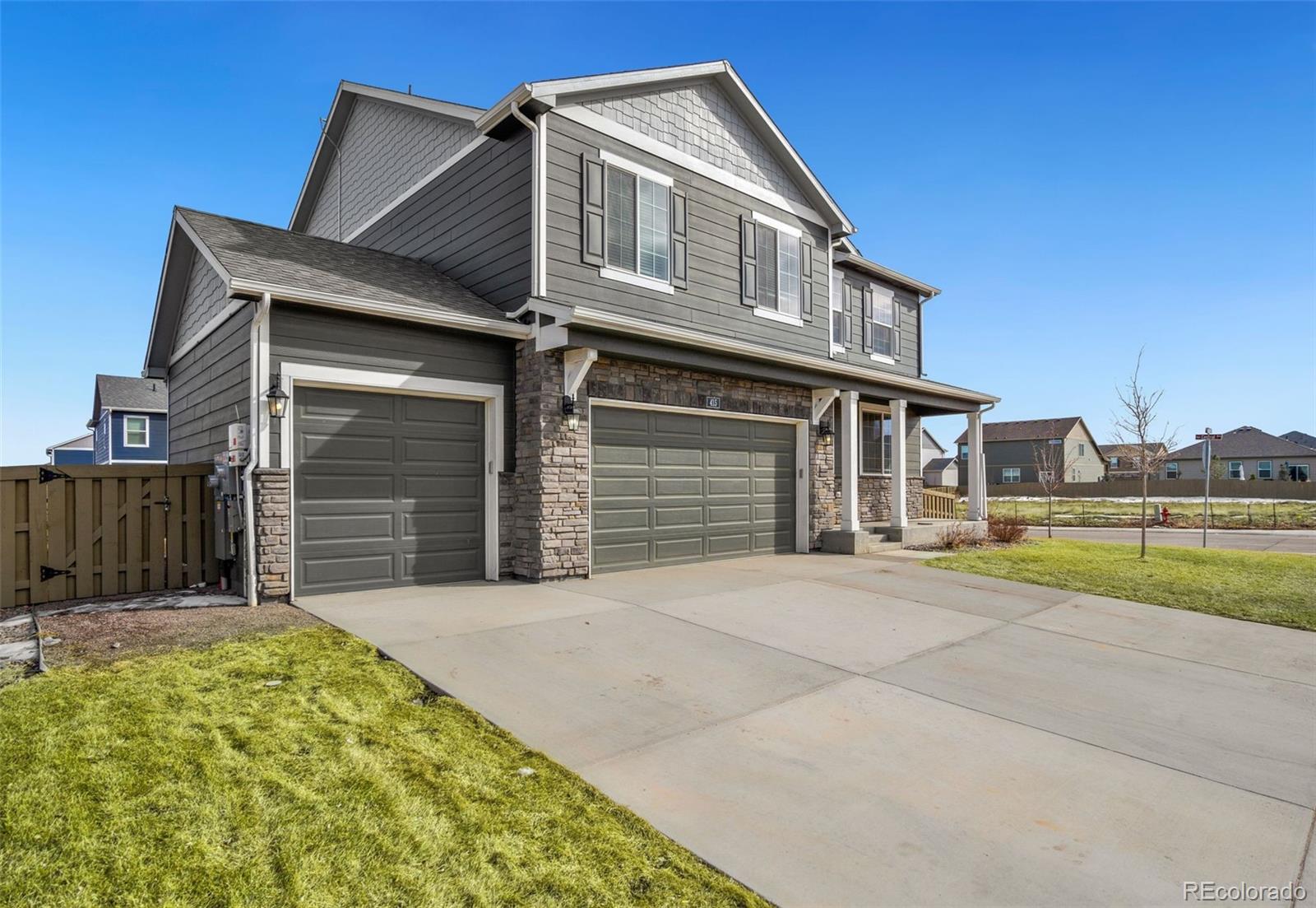 415 3rd Street Severance, CO 80550 - Photo 3 of 27 a front view of a house with a yard