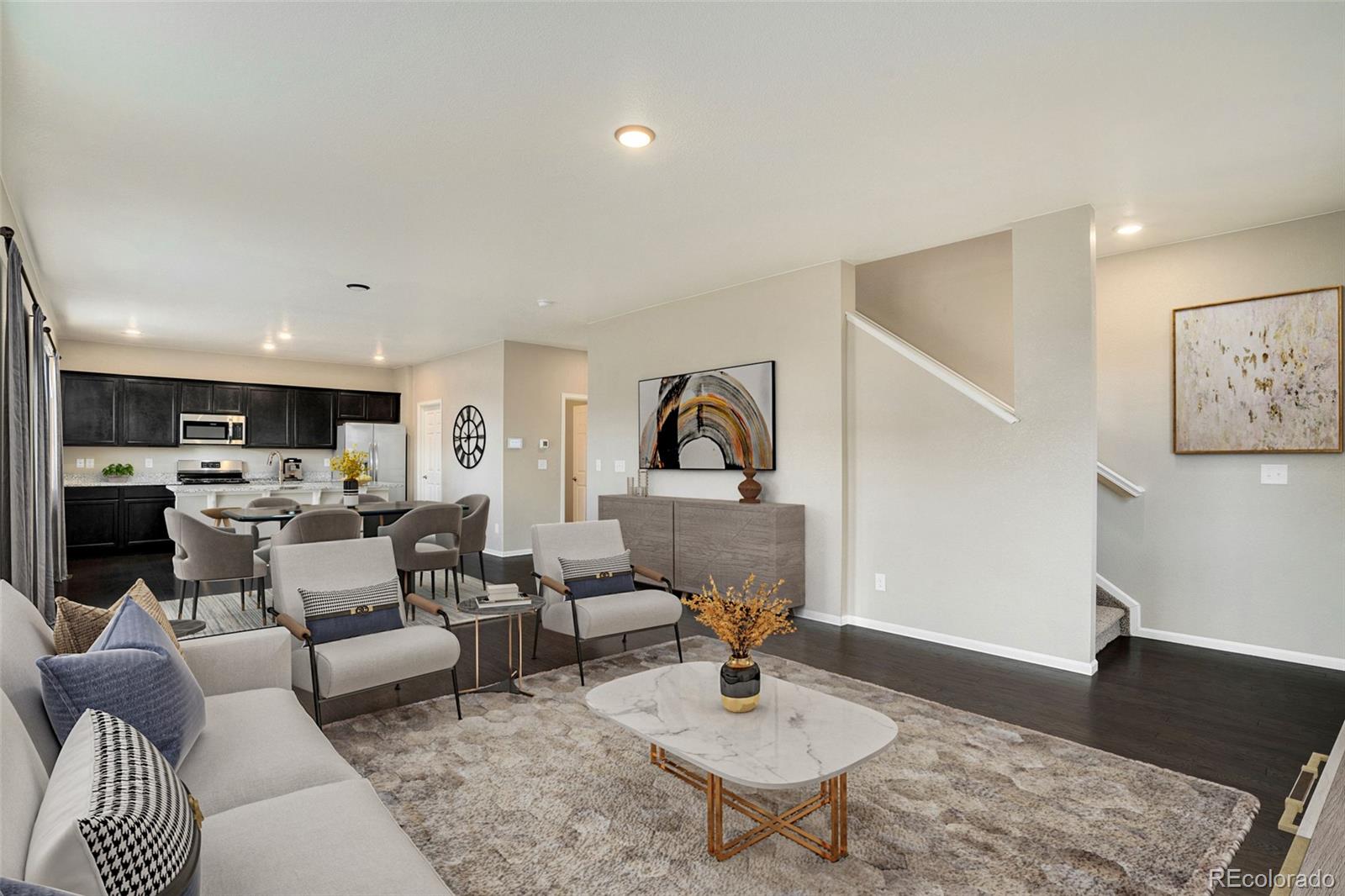 415 3rd Street Severance, CO 80550 - Photo 5 of 27 a living room with furniture and wooden floor