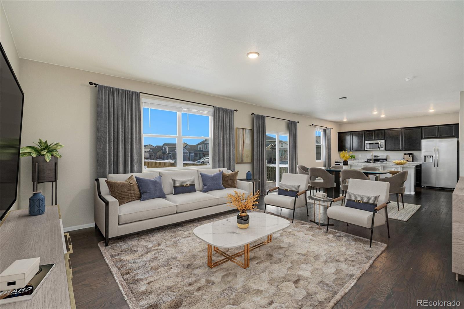415 3rd Street Severance, CO 80550 - Photo 6 of 27 a living room with furniture and a large window