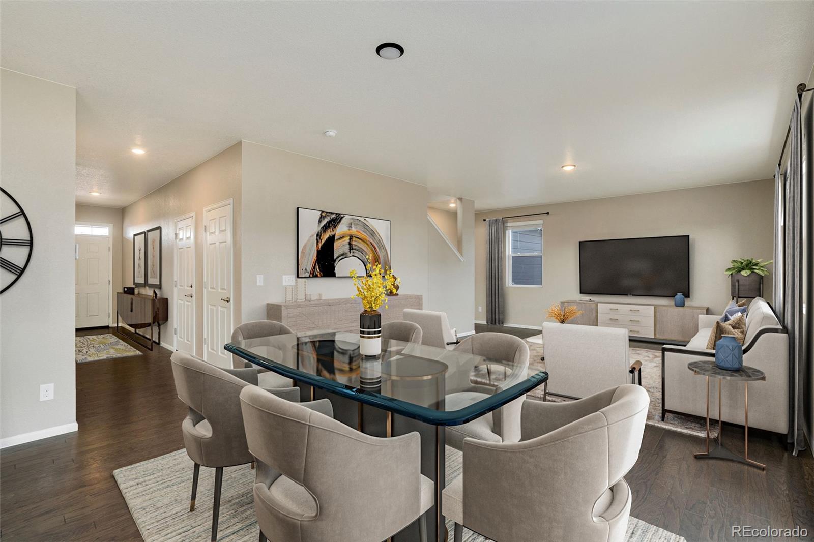 415 3rd Street Severance, CO 80550 - Photo 9 of 27 a living room with furniture a flat screen tv and a large window