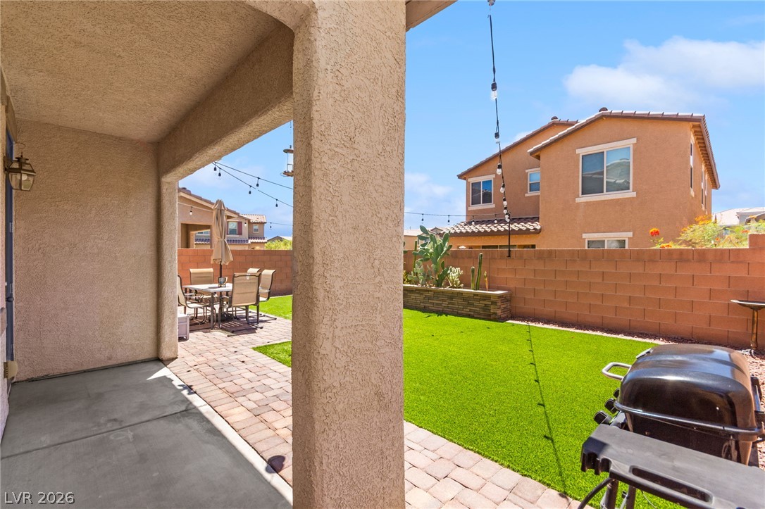 6435 Point Isabel Way Las Vegas, NV 89122 - Photo 44 of 57 A spacious patio and yard offers delightful outdoor living.