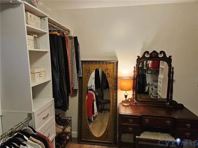 a view of a dining room with furniture wooden floor and chandelier