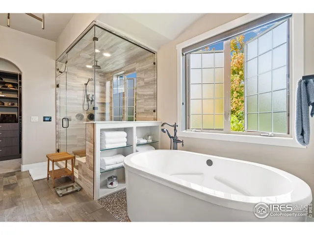 a bathroom with a granite countertop sink a mirror and a window