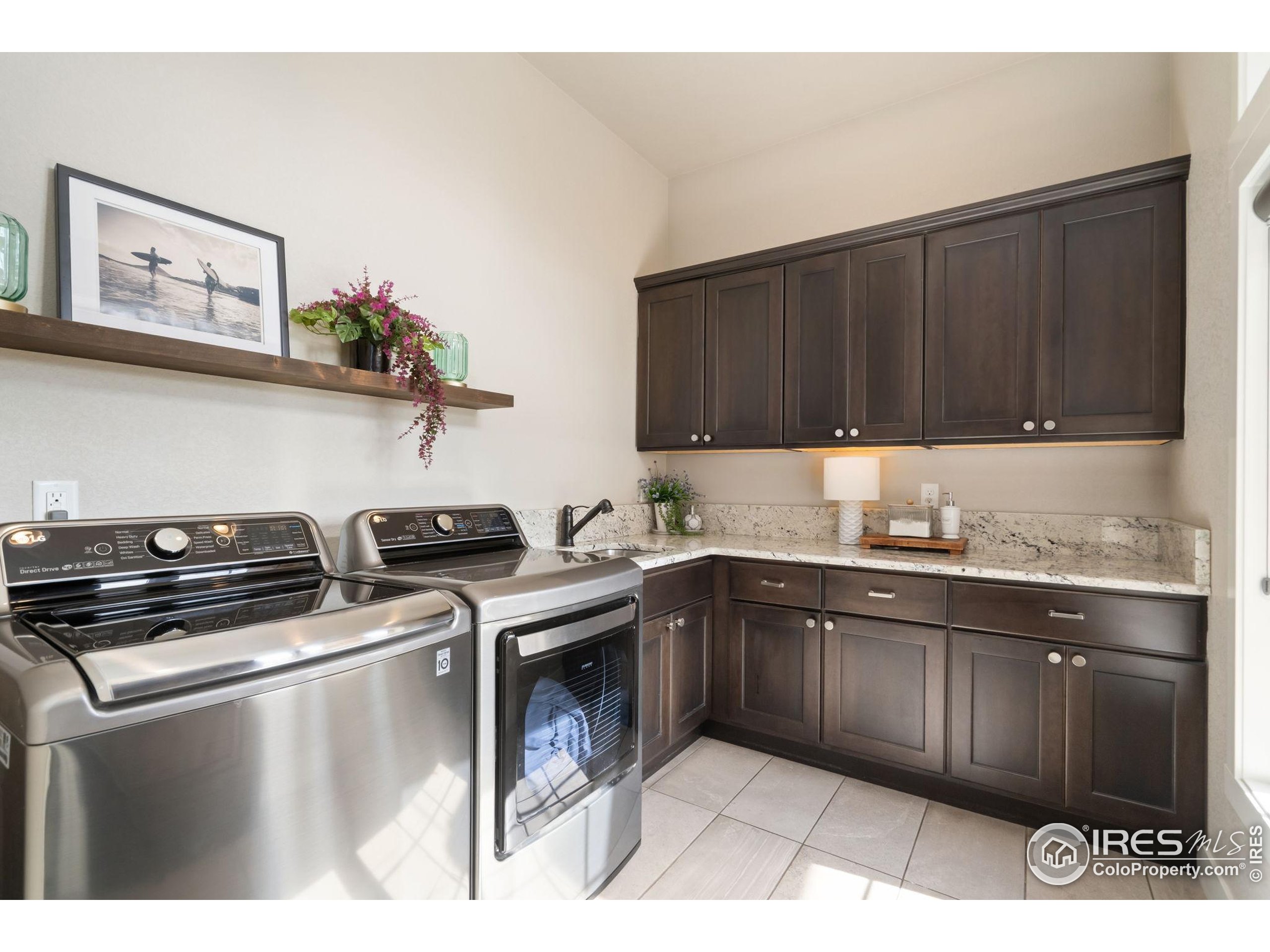 3828 Valley Crest Drive Timnath, CO 80547 - Photo 24 of 50 a kitchen with a stove and a sink