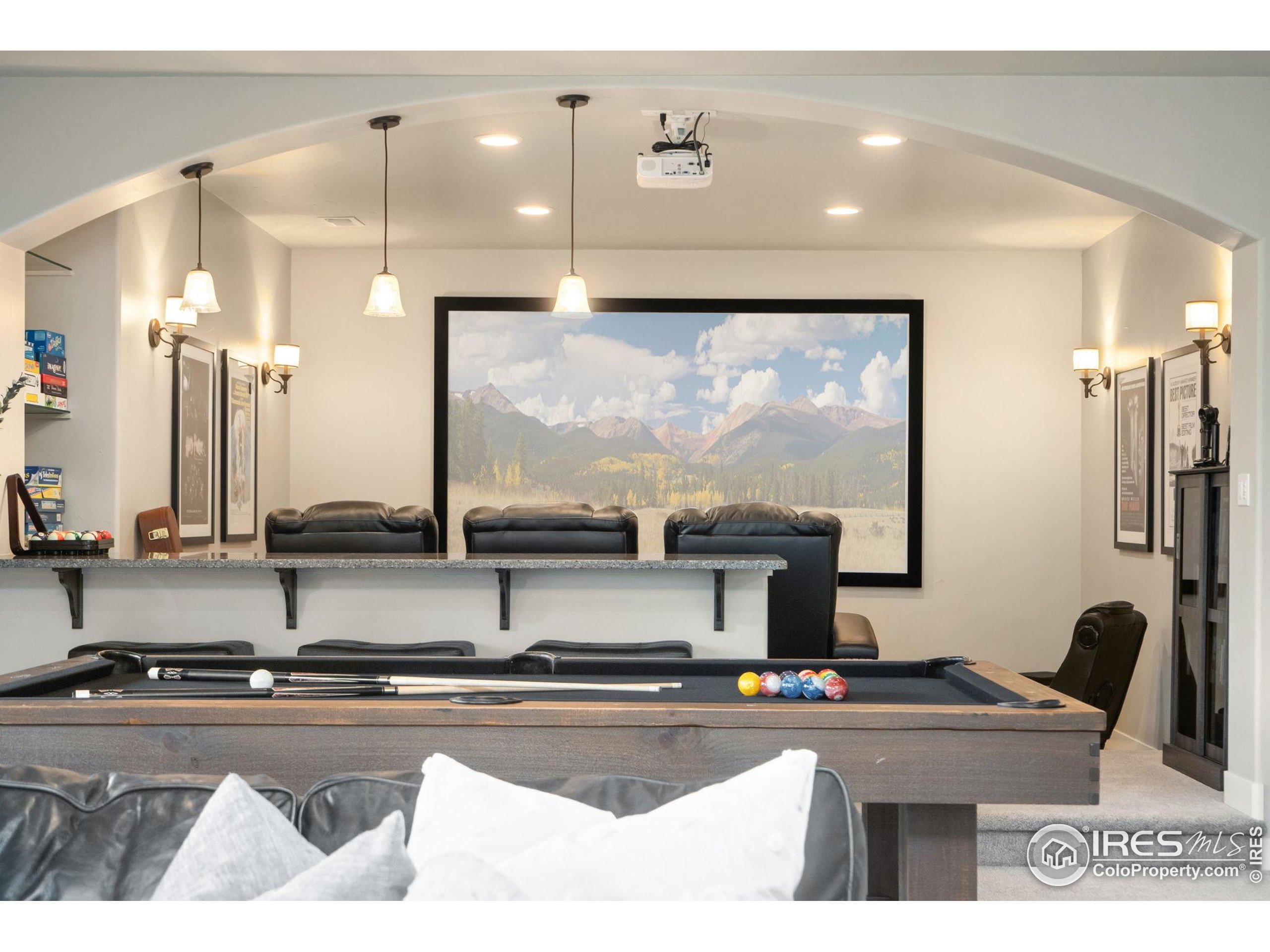 3828 Valley Crest Drive Timnath, CO 80547 - Photo 34 of 50 a kitchen with stainless steel appliances kitchen island granite countertop a sink and a granite counter tops