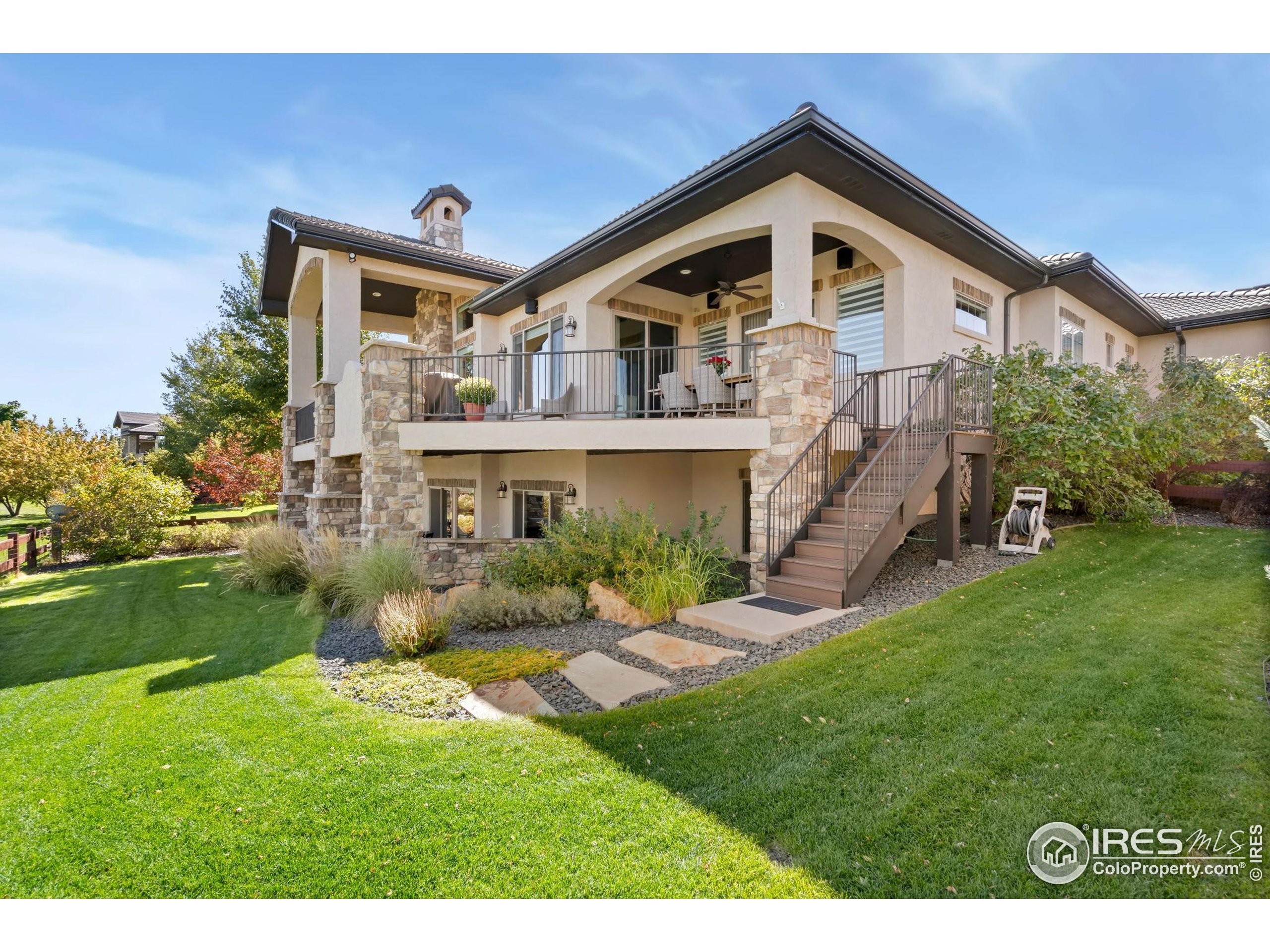 3828 Valley Crest Drive Timnath, CO 80547 - Photo 48 of 50 a front view of a house with a yard