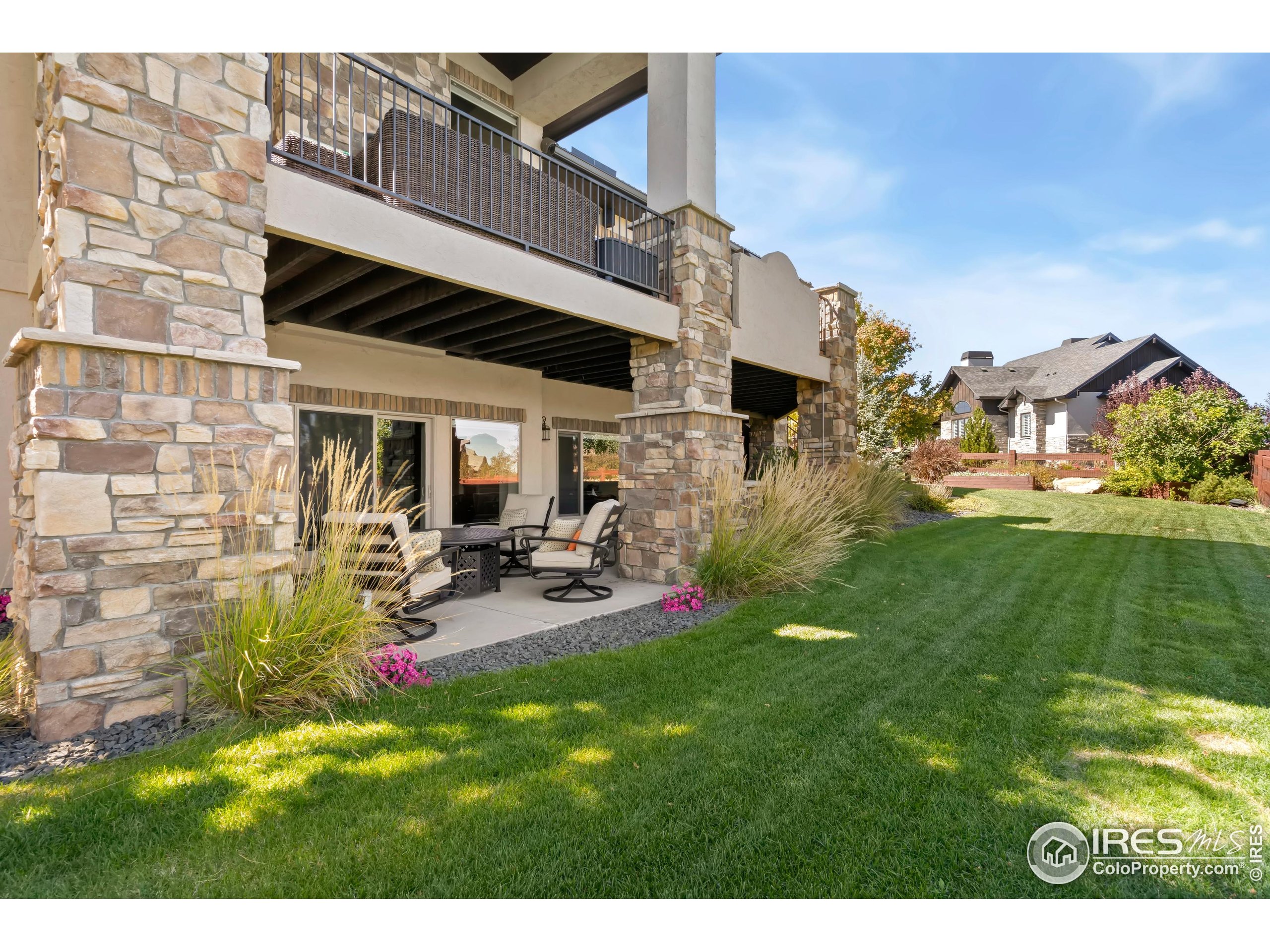 3828 Valley Crest Drive Timnath, CO 80547 - Photo 49 of 50 a view of a house with a yard and sitting area