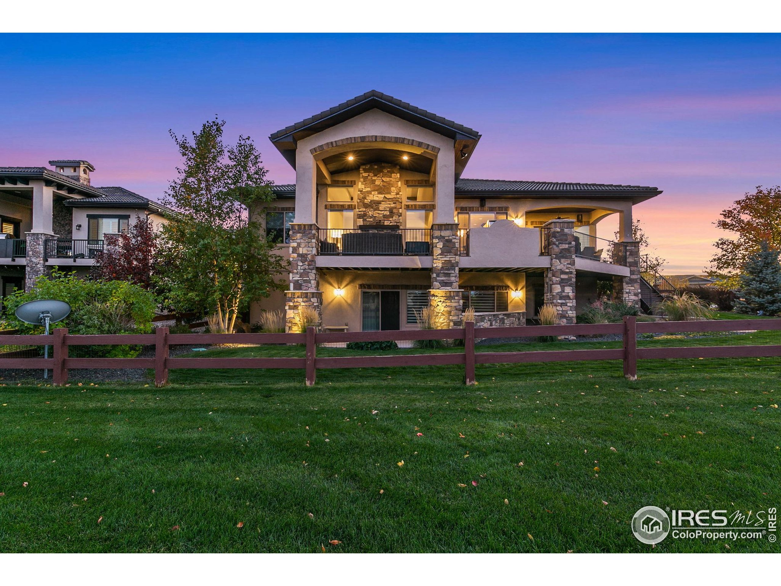 3828 Valley Crest Drive Timnath, CO 80547 - Photo 50 of 50 a front view of a house with a garden