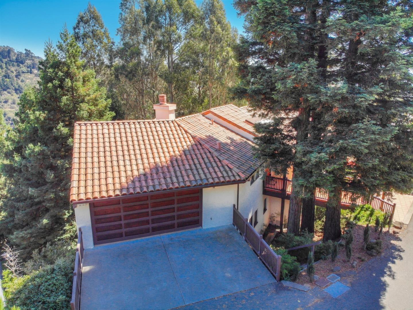 6840 Buckingham Boulevard Berkeley, CA 94705 - Photo 11 of 50 a front view of a house with a yard