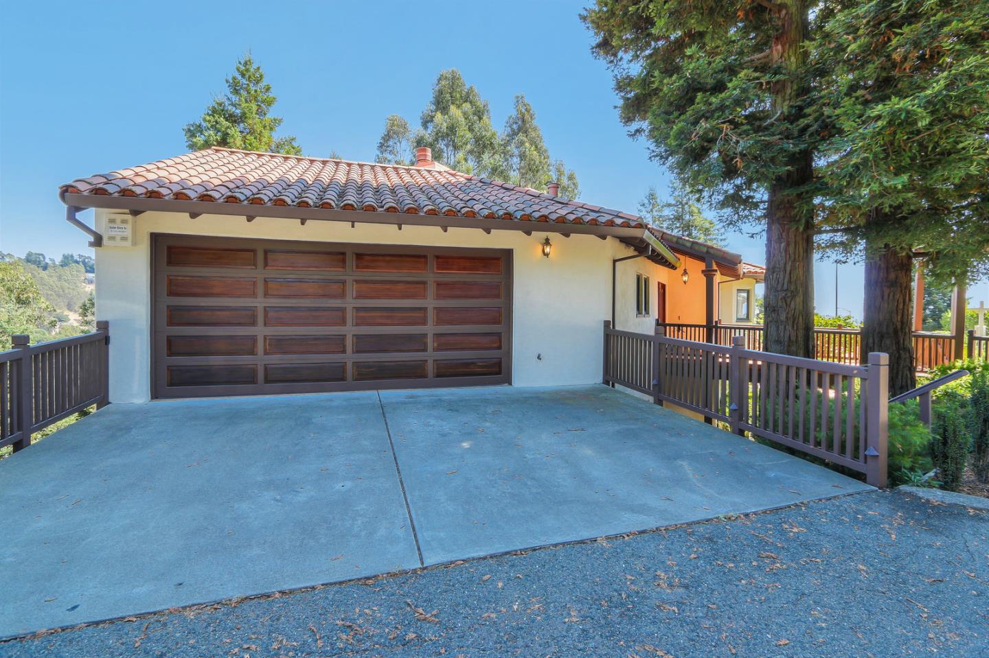 6840 Buckingham Boulevard Berkeley, CA 94705 - Photo 15 of 50 a view of a house with a garage