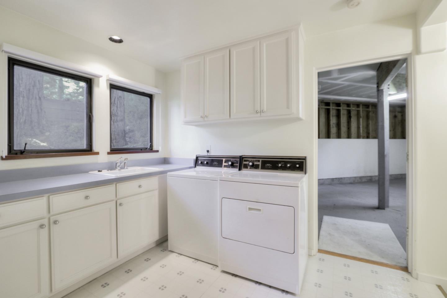 6840 Buckingham Boulevard Berkeley, CA 94705 - Photo 25 of 50 a kitchen with white cabinets and sink