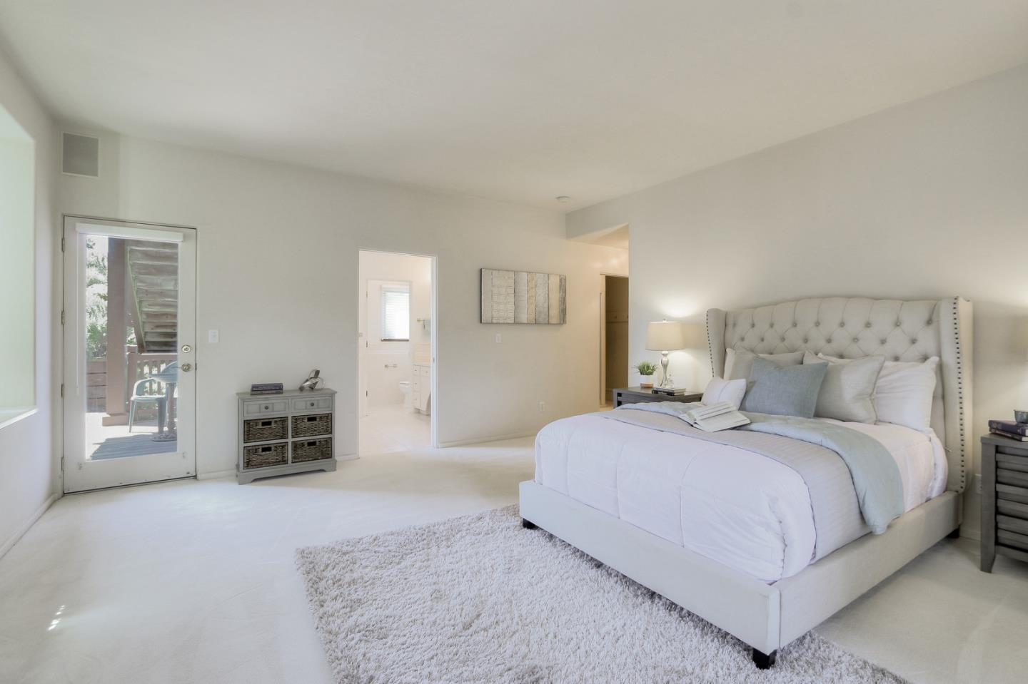 6840 Buckingham Boulevard Berkeley, CA 94705 - Photo 30 of 50 a bedroom with a large bed and a couch