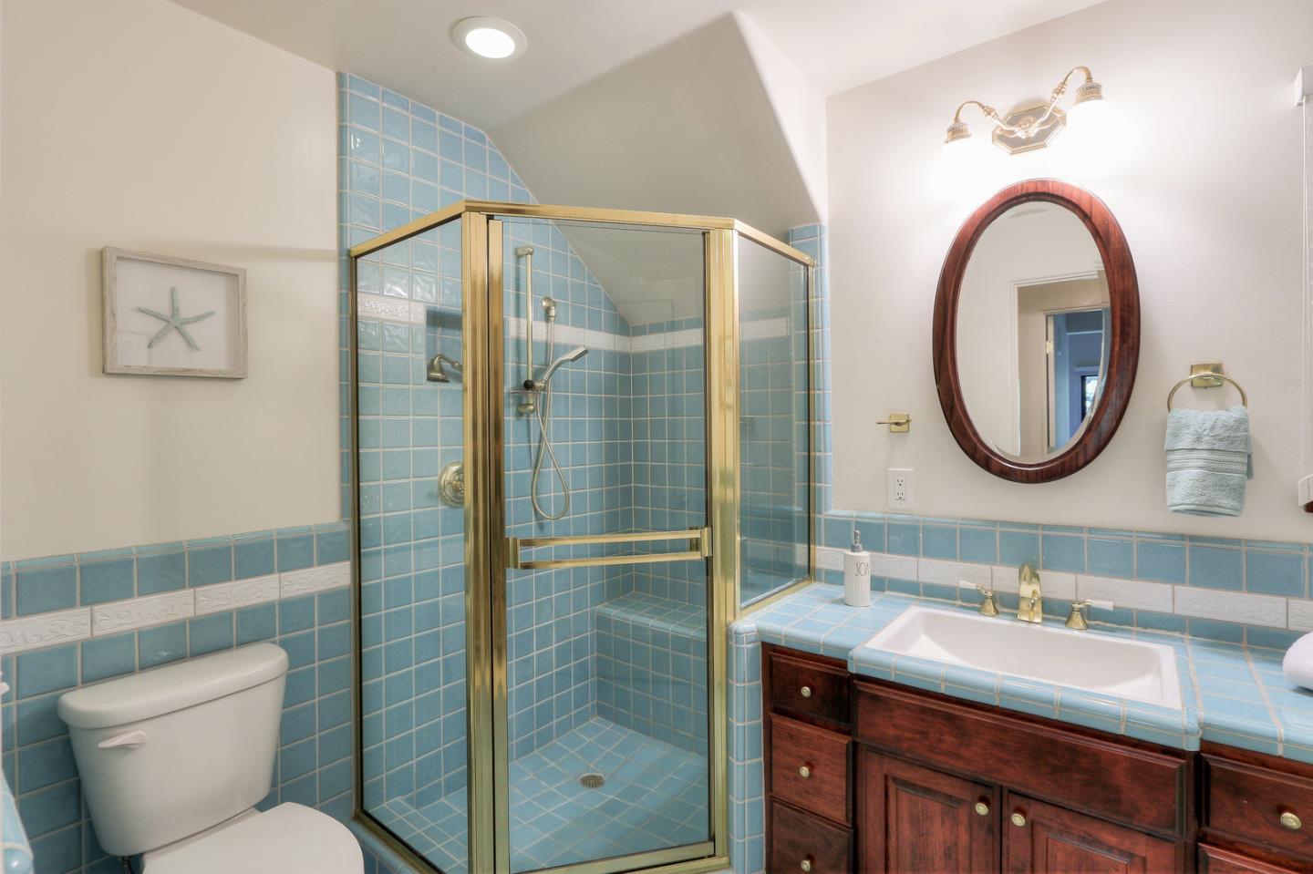 6840 Buckingham Boulevard Berkeley, CA 94705 - Photo 32 of 50 a bathroom with a sink and a mirror