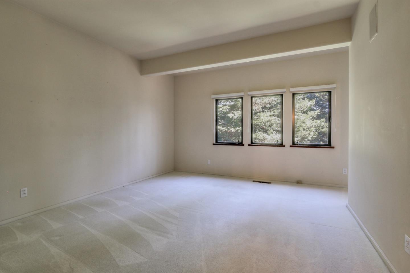 6840 Buckingham Boulevard Berkeley, CA 94705 - Photo 34 of 50 an empty room with windows