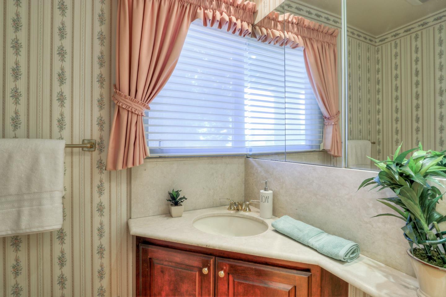 6840 Buckingham Boulevard Berkeley, CA 94705 - Photo 37 of 50 a bathroom with a sink and a mirror