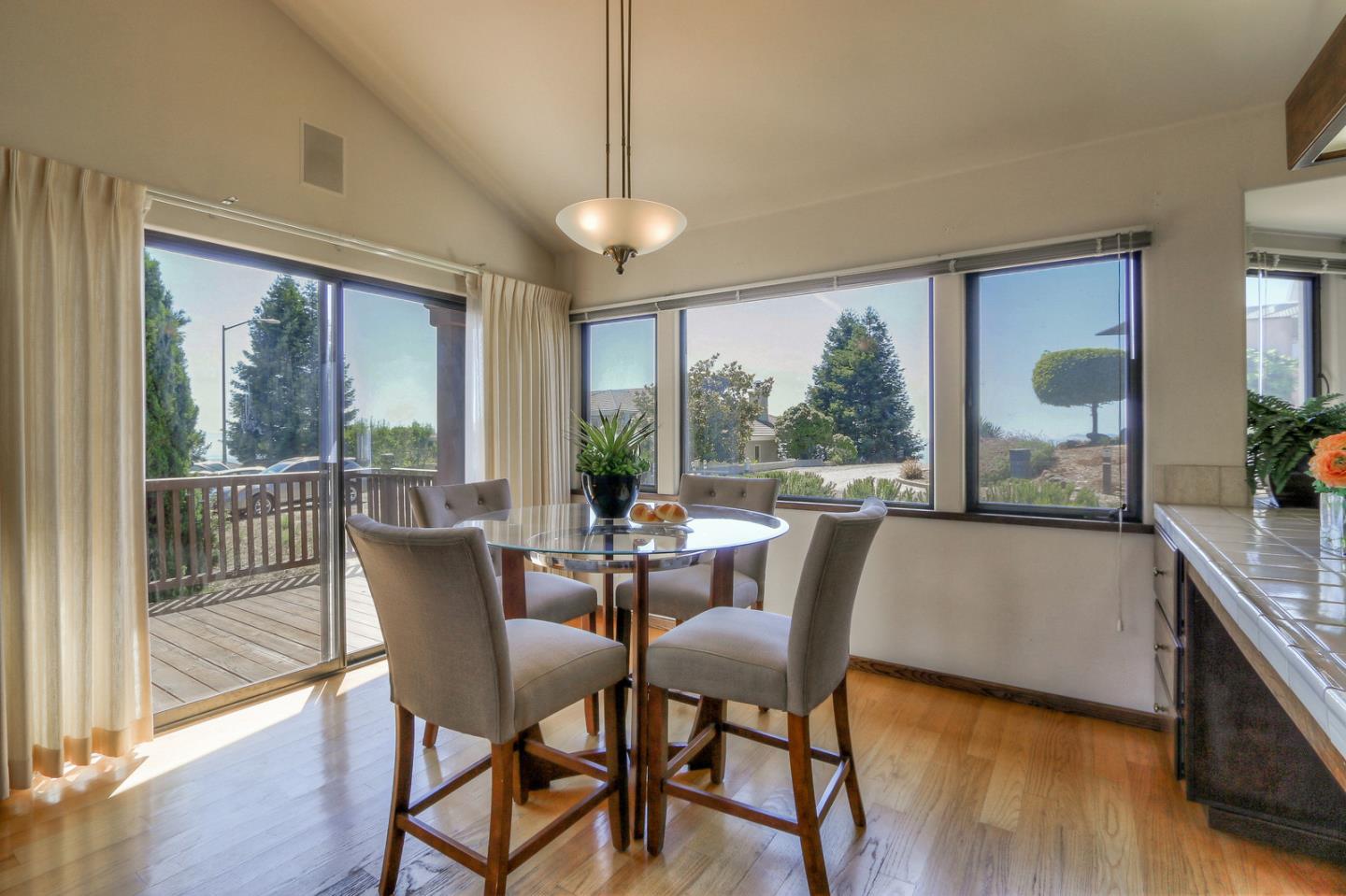6840 Buckingham Boulevard Berkeley, CA 94705 - Photo 38 of 50 a view of a dining room with furniture window and wooden floor
