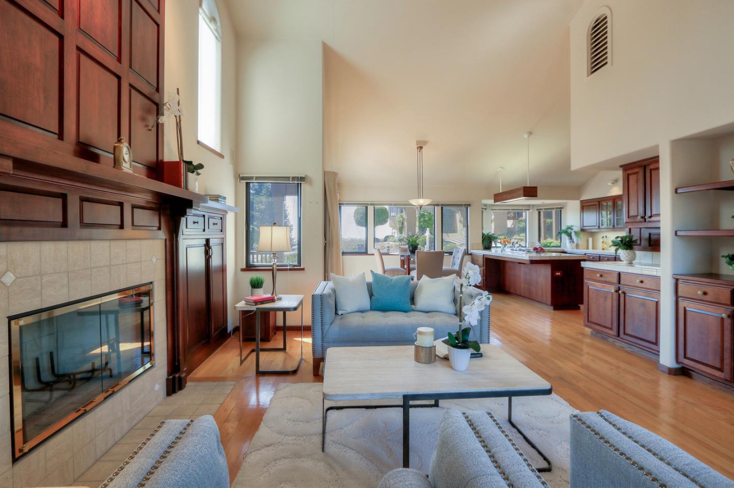 6840 Buckingham Boulevard Berkeley, CA 94705 - Photo 41 of 50 a living room with furniture and a fireplace