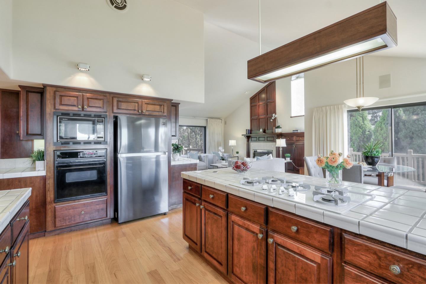 6840 Buckingham Boulevard Berkeley, CA 94705 - Photo 44 of 50 a kitchen with stainless steel appliances granite countertop a sink stove and refrigerator