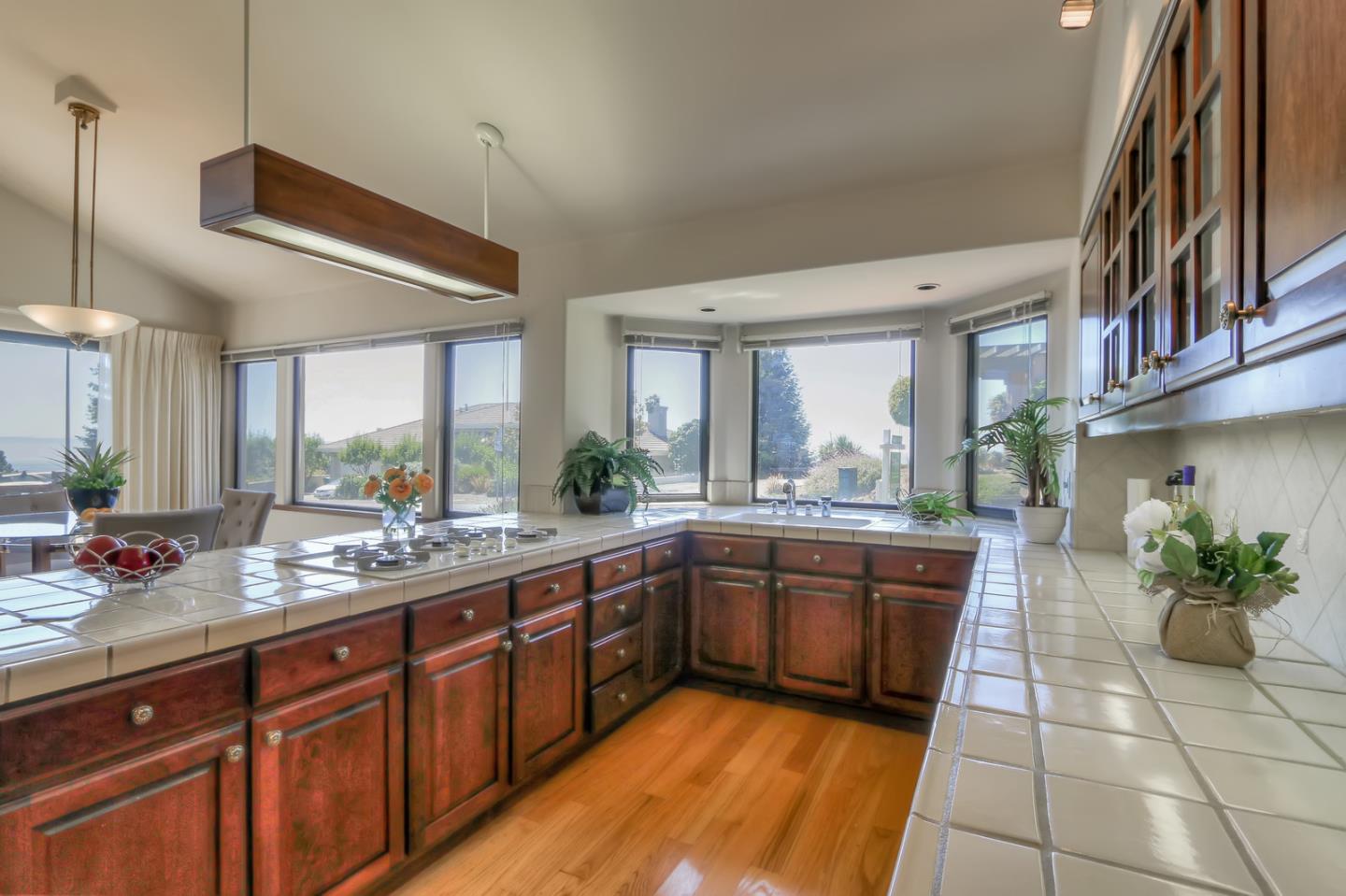 6840 Buckingham Boulevard Berkeley, CA 94705 - Photo 46 of 50 a large kitchen with stainless steel appliances granite countertop a sink and cabinets